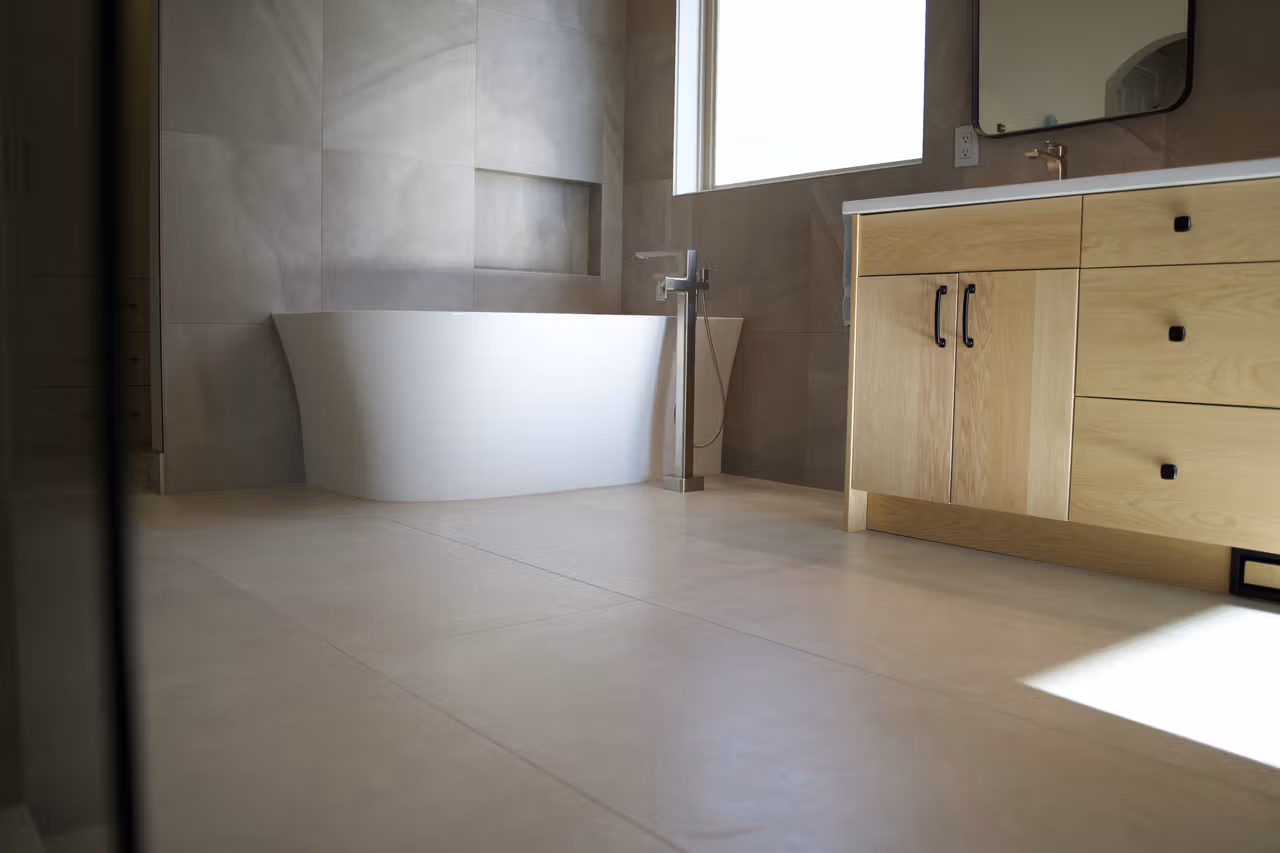 Finished bathroom renovation with freestanding tub in Kelowna